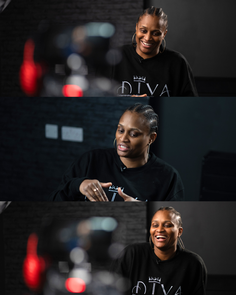 Client during cinematic interview shoot with dramatic studio lighting