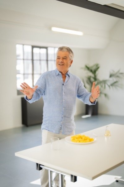 Client presenting on camera during studio brand video shoot